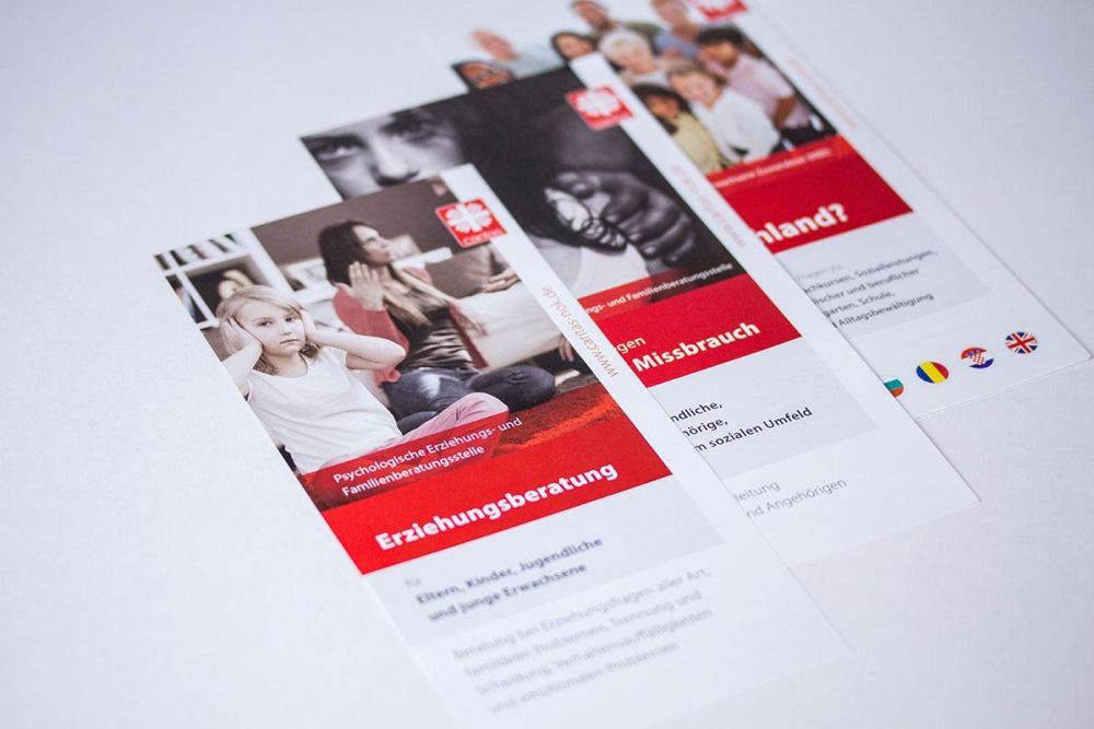 Verschiedene Flyer für die Caritas NOK