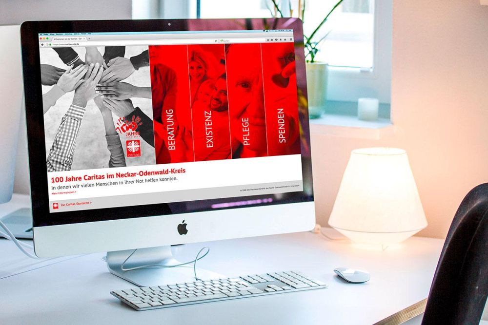 Caritas NOK Webseite auf einem iMac
